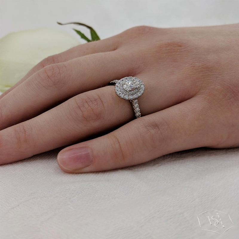 sarah-layton-platinum-oval-cut-diamond-halo-ring-0-72ct