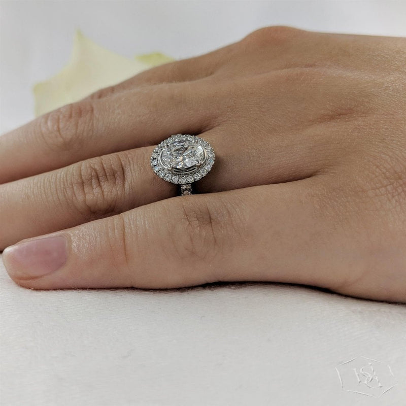 sarah-layton-platinum-oval-cut-diamond-halo-ring-1-05ct